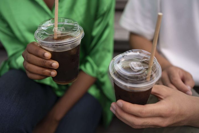 front view friends with iced coffee scaled